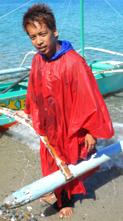 beach boy in poncho